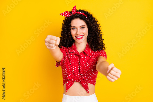 Photo of cute optimistic brunette hair lady drive wear red top isolated on yellow color background