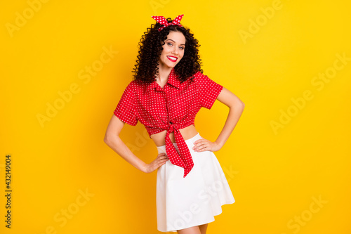 Photo of optimistic nice brunette lady stand wear shirt band isolated on yellow color background © deagreez