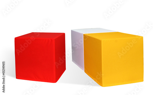  blank red white yellow cubes table made of foam rubber in a fabric cover. Isolated over white background © Adam
