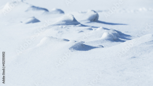 shadows and textures on white snow in winter