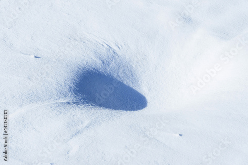 Fototapeta Naklejka Na Ścianę i Meble -  shadows and textures on white snow in winter