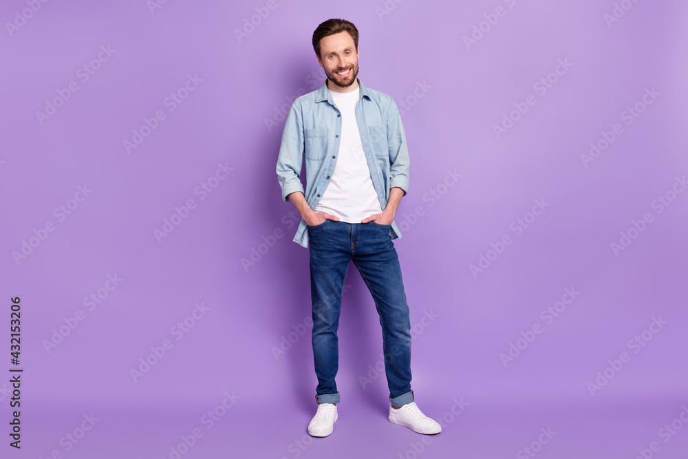 Fototapeta premium Full size photo of happy smiling cheerful good mood man hold hands pockets isolated on purple color background