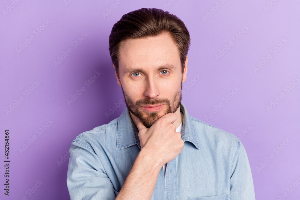 Photo of thoughtful confident young gentleman dressed jeans outfit arm chin isolated violet color background Photo of thoughtful confident young gentleman dressed jeans outfit arm chin isolated violet color background