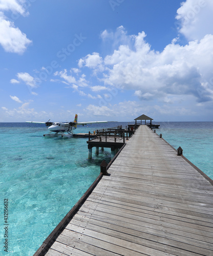 wooden pier at tropical island resort in Maldives