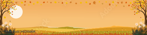 Fantasy landscapes of Countryside in autumn,Panoramic mid autumn with farm field, mountain,wild grass and leaves falling from trees in yellow and orange foliage. Wonderland landscape in fall season
