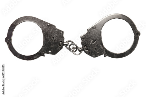 Caught silver handcuffs isolated on a white background