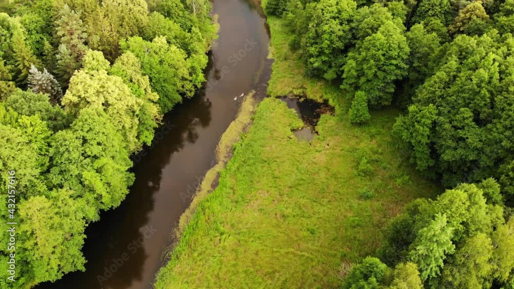 Aerial view. Green forest and river Brda, famous waterway, canoe trail in Tuchola national park, Poland. Green summer landscape in Europe. Aerial view. Green forest and river Brda, famous waterway, canoe trail in Tuchola national park, Poland. Green summer landscape in Europe.