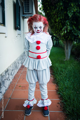 Girl wearing clown costume photo