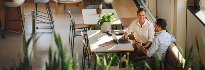 Business partners having meeting in coworking office space