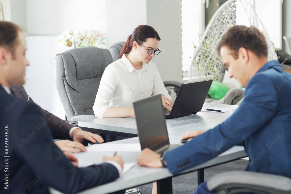 Young attractive business woman working in the office, developing her strategy Young attractive business woman working in the office, developing her strategy