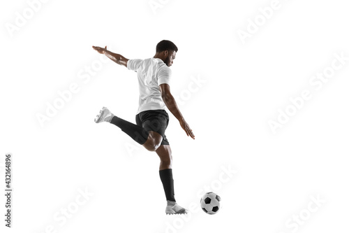 One African man football player training isolated on white background. Concept of sport, movement, energy and dynamic. © master1305