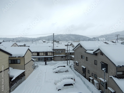 houses covered by snow in winter