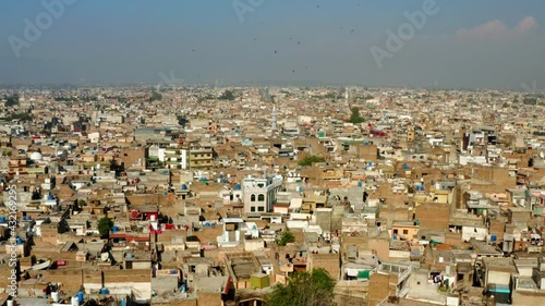 Flying Towards Rawalpindi Skylines, Capital Of Rawalpindi Division In Punjab Province Of Pakistan. - Aerial Drone Shot photo