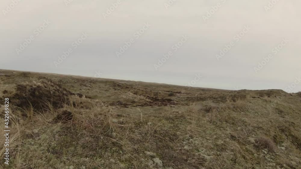 Drone Over Hilly Meadow Towards Wetland In National Park At Texel Island In North Holland, Netherlands. - FPV Drone Over Hilly Meadow Towards Wetland In National Park At Texel Island In North Holland, Netherlands. - FPV