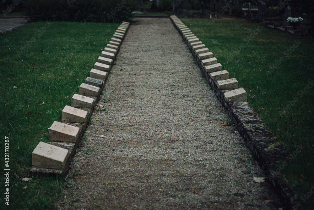soldier cemetery of world war one in Latvia. Brother`s graveplace in two lines and pathway between them. 
