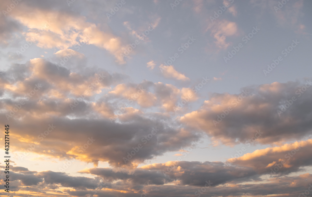 Evening sky with clouds at sunset. Scenery. Wallpaper. Horizontal photo with place for text. 