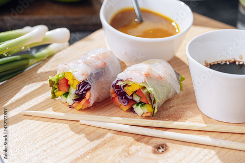 fresh springrolls with vegetables and shrimps. a healthy dish of rice paper and fresh organic vegetables photo