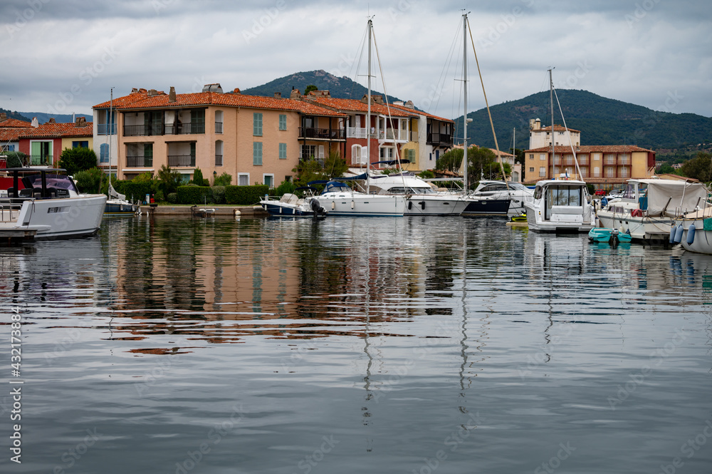 Travel and vacation destination, view on houses, roofs, canals and boats in Port Grimaud, Var, Provence, French Riviera, France Travel and vacation destination, view on houses, roofs, canals and boats in Port Grimaud, Var, Provence, French Riviera, France