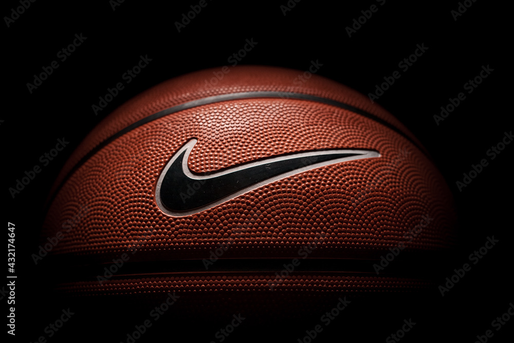 Nike brand, basketball ball Nike Baller. Orange rubber outdoor ball,  ultra-durable cover, close-up on a black background. Stock Photo | Adobe  Stock