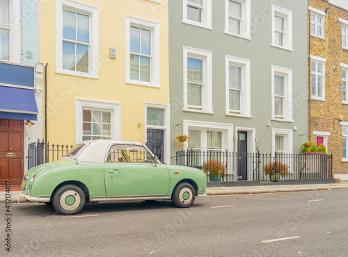 July 2020. London. Colourful buildings and Nissan Figaro car in Notting Hill, London, England © chris