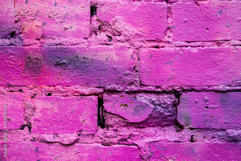 Purple and old brick wall. Close up view