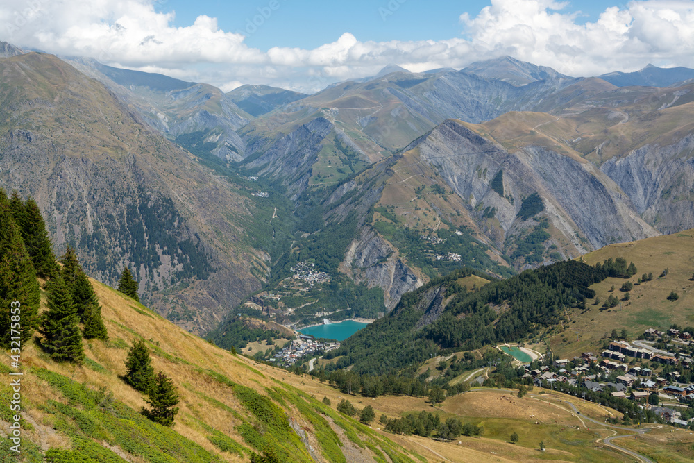 Fototapeta premium Hiking near ski station Les deux Alpes and view on Alpine mountains peaks in summer, Isere, France