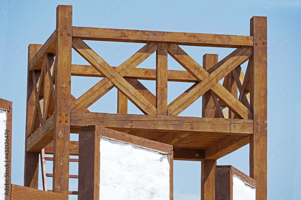 Fototapeta premium antique wooden watchtower against sky