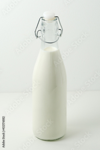 A glass bottle filled with milk 