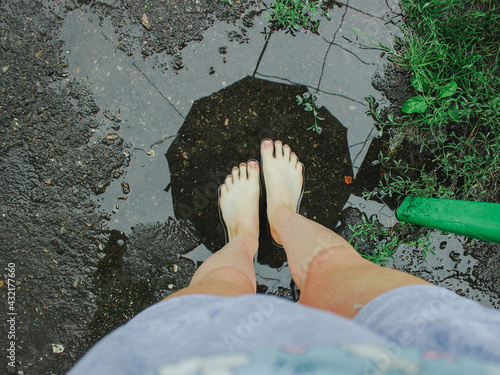 man is reflected in a puddle