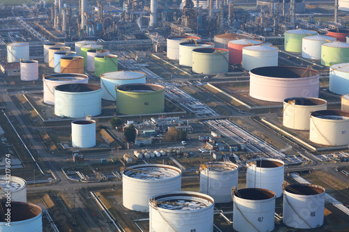 Aerial photograph taken from a helicopter of the oil refinery at Immingham docks in Humberside. Many petrochemical storage tanks can be seen and the plant is in the background photo