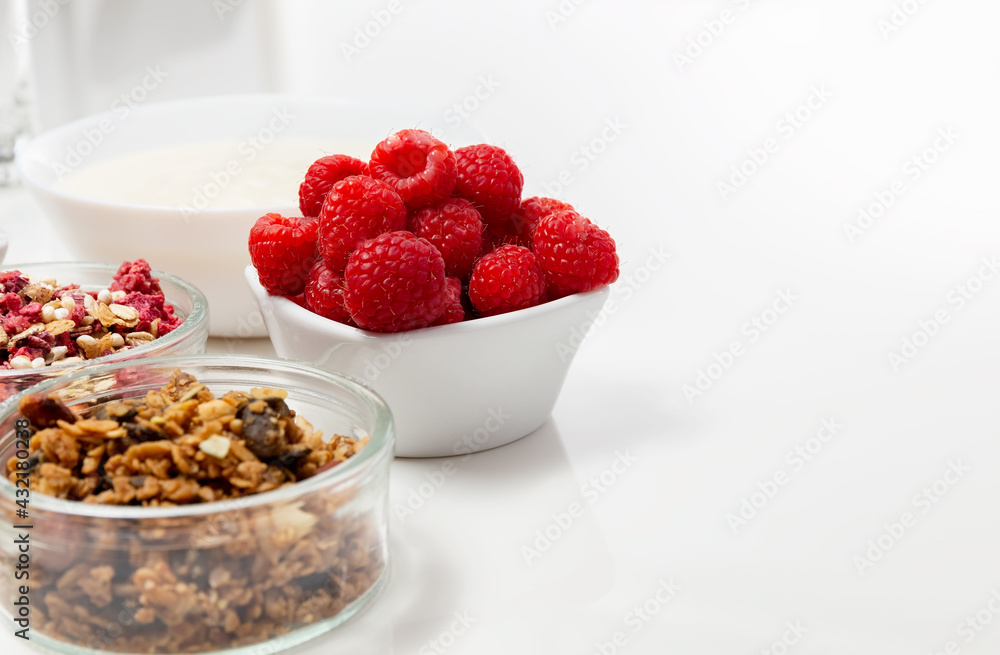 Ingredients for a healthy breakfast. Muesli, berries and yogurt. Healthy eating. Sports fitness menu. Concept. Copy space. High quality photo Ingredients for a healthy breakfast. Muesli, berries and yogurt. Healthy eating. Sports fitness menu. Concept. Copy space. High quality photo