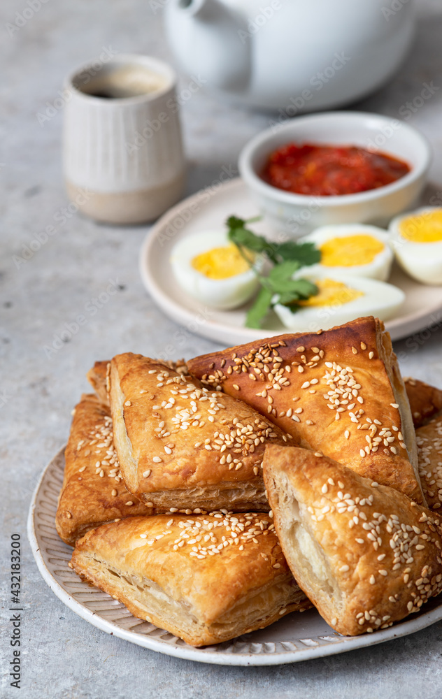 Mediterranean breakfast - burek with cheese, eggs, sauce and coffee. Mediterranean breakfast - burek with cheese, eggs, sauce and coffee.