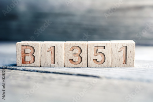 B1351 SARS-CoV-2 Mutation Written On Wooden Blocks On A Board photo