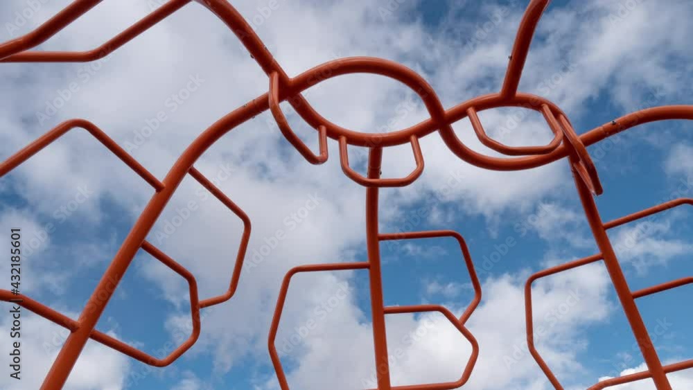 Clouds Through Abstract Orange Metal Structure Motion Timelapse Wide Angle