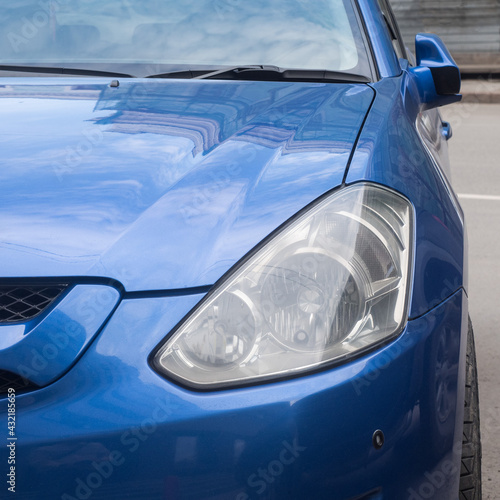 blue car front view close up