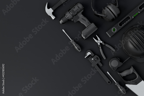 Fototapeta Naklejka Na Ścianę i Meble -  Top view of monochrome construction tools for repair and installation on black