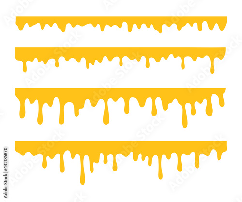 Honey is dripping. The thick yellow liquid dripping onto the ground.