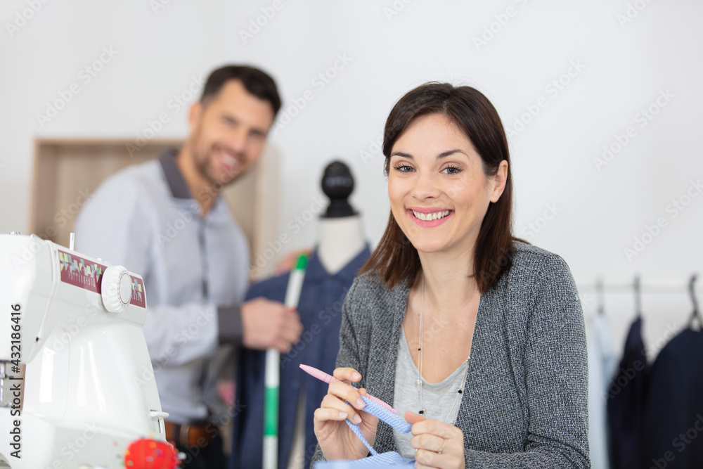 happy smiling creative fashion designer in studio happy smiling creative fashion designer in studio