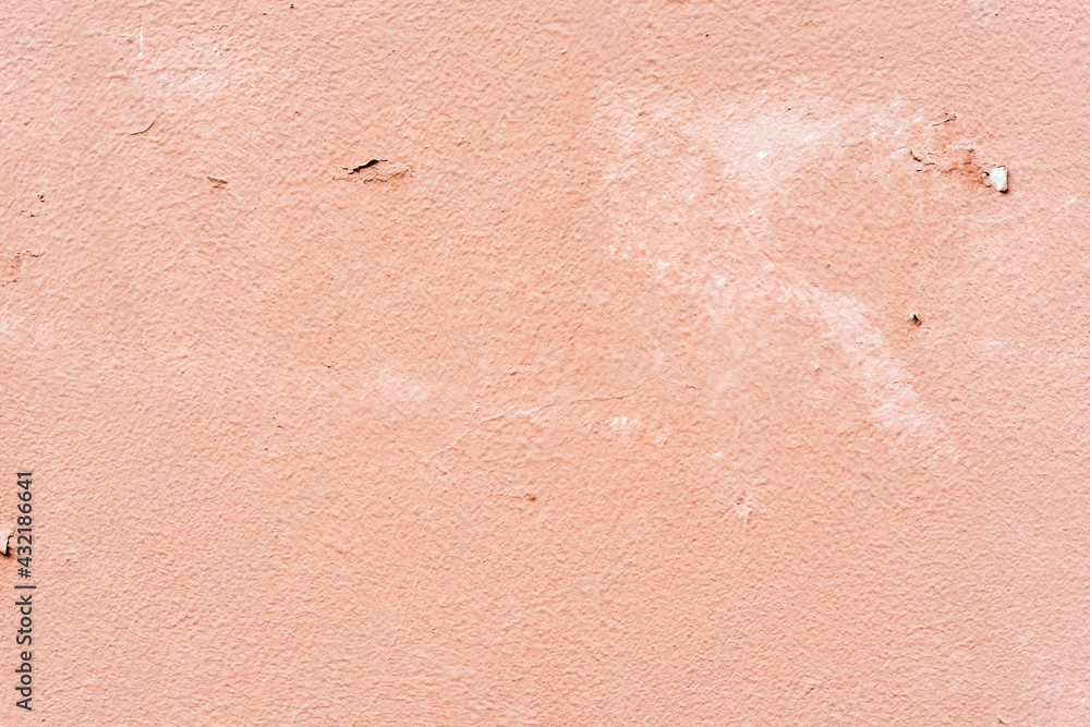 Fototapeta premium Rough pink wall. Close up view