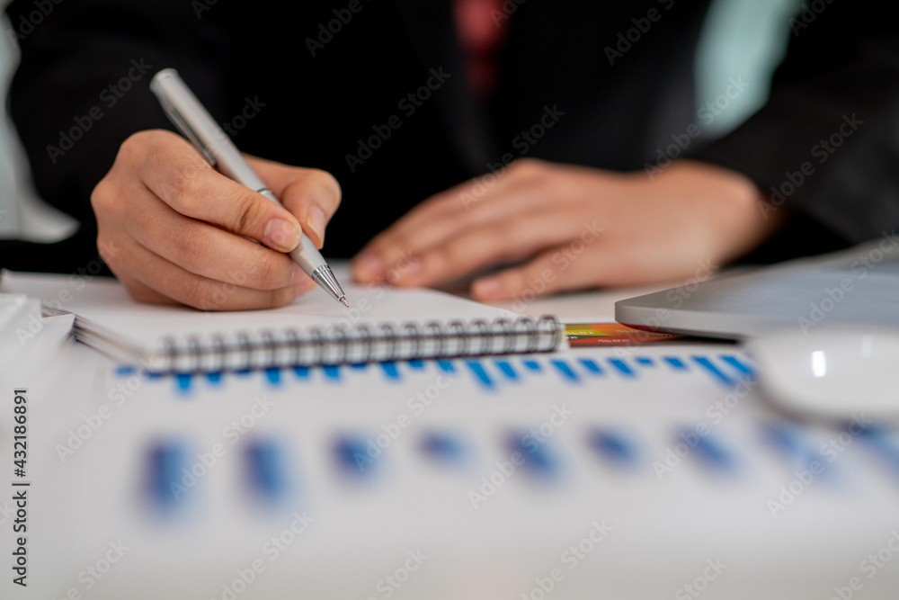 Close up of Businesswoman hands hold documents with financial statistic stock photo,discussion and analysis data the charts and graphs. Finance concept Close up of Businesswoman hands hold documents with financial statistic stock photo,discussion and analysis data the charts and graphs. Finance concept