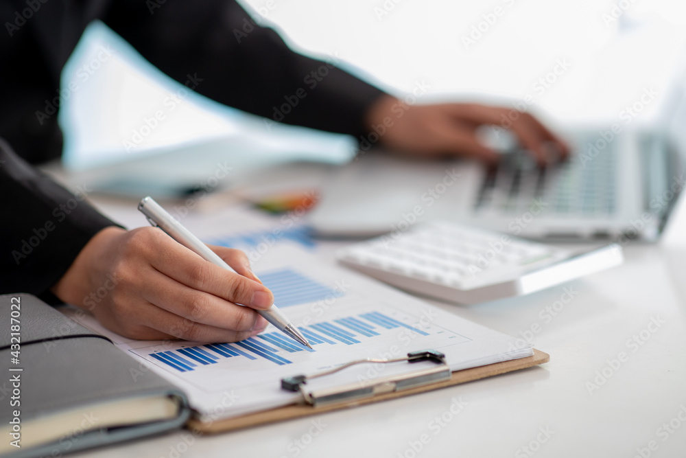 Close up of Businesswoman hands hold documents with financial statistic stock photo,discussion and analysis data the charts and graphs. Finance concept Close up of Businesswoman hands hold documents with financial statistic stock photo,discussion and analysis data the charts and graphs. Finance concept