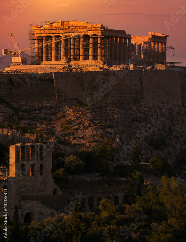 Parthenon ancient temple and Acropolis hill under dramatic sky, Athens, Greece