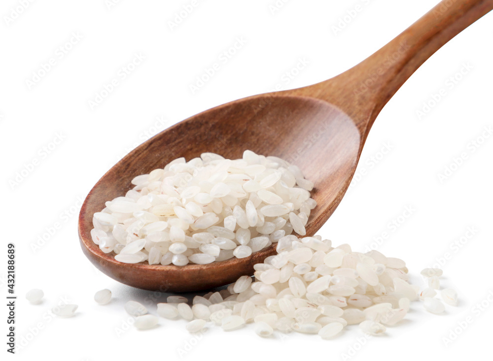Raw rice in a wooden spoon on a white background. Isolated Raw rice in a wooden spoon on a white background. Isolated
