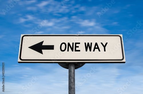 One way road sign, arrow on blue sky background. One way blank road sign with copy space. Arrow on a pole pointing in one direction.