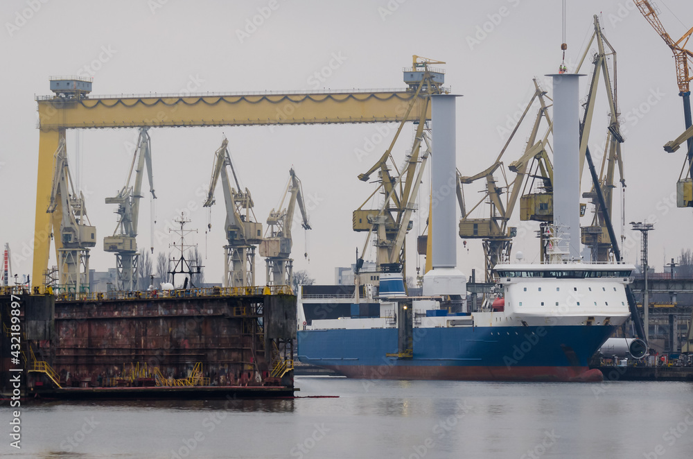 SHIPYARD - Ship on the background of industrial infrastructure 
