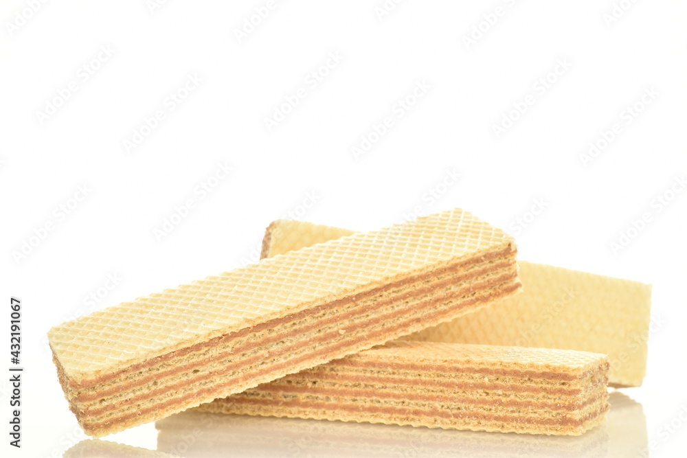 Three sweet vanilla waffles, close-up, isolated on white. Three sweet vanilla waffles, close-up, isolated on white.