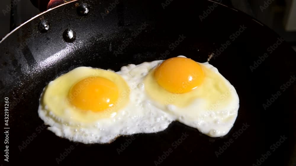 Cooking eggs in a frying pan. Time Lapse. Top view. Cooking process. Breakfast concept. Cooking eggs in a frying pan. Time Lapse. Top view. Cooking process. Breakfast concept.