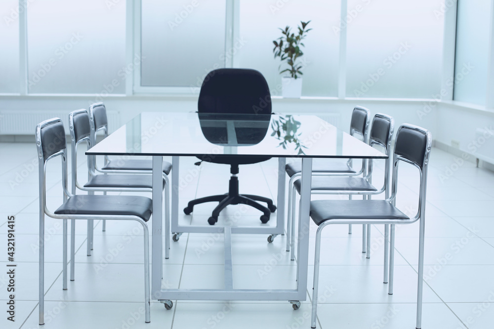 Fototapeta premium Spacious, bright, modern office space. Glass table. A place to learn at work.