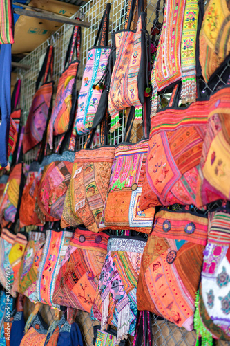 Handmade Souvenir Bags Asian style are hung and display for sales in the shop