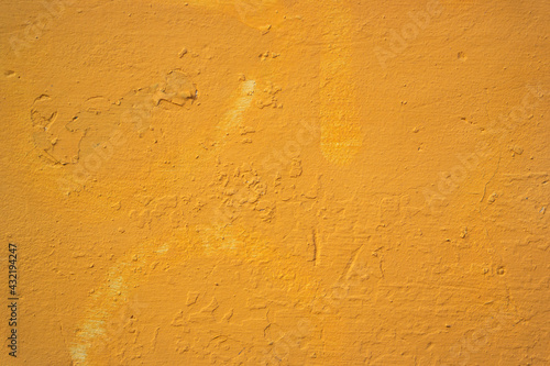Yellow painted grungy wall texture